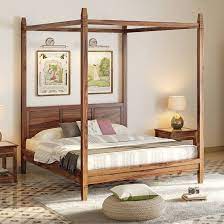 A bottom sheet is laid above the mattress and bed occupants lie on it. Four Poster Beds Buy Canopy Beds Online At Best Prices In India Urban Ladder