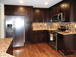 all new kitchen with rich dark cabinets