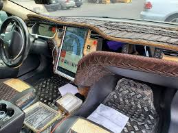 A stark and nearly buttonless interior design is classic tesla. Crocodile Dundee Would Be Proud Of This Tesla Model S Custom Interior Carscoops