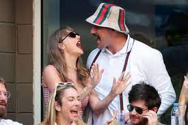 Taylor Swift and Travis Kelce Rock Out to 'I Believe in a Thing Called Love'