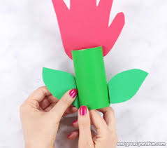 Press the toilet paper roll flat, and cut into thirds. Paper Roll Handprint Flowers Mother S Day Craft Idea Easy Peasy And Fun