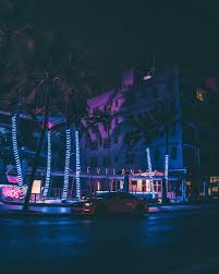 Along the main road there are many leaf links, a golf club, is in the middle of vice city. Cars On Road Near Buildings During Night Time Photo Free Miami Beach Image On Unsplash