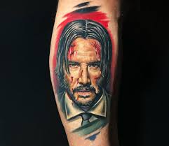 The fourth tattoo is a praying hand. John Wick Tattoo By Lena Art Photo 30595