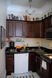 The homeowners opted to display pretty porcelain. 20 Stylish And Budget Friendly Ways To Decorate Above Kitchen Cabinets Amazing Diy Interior Home Design