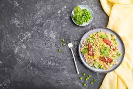 By itself, one cup of polenta contains about 145 calories, 1 gram of fat, 3 grams of protein, 3 grams of fiber and no cholesterol. Quinoa Porridge With Green Pea Corn And Dried Tomatoes On Stock Photo Crushpixel