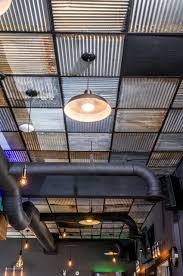 Create A Nice Industrial Look With Barn Tin Tiles From Ceilingconnex Free Shipping On Orders Over 400 Ce Rustic Living Room Design Ceiling Design Barn Tin