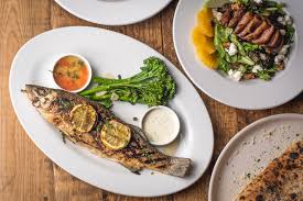 The italian tradition involves family gathering for a ~feast~ of seven seafood dishes. Feast Of The Seven Fishes At Tavolino Experience A Traditional Italian American Christmas Eve Menu