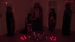 Something very strange happened during a satanic ritual, a candle lit by  itself!