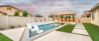 You can transform even the most modern or contemporary of backyards into a tropical retreat with a curvy pool and dark waters. Small Modern Lounge Pool Gilbert Arizona Premier Paradise Inc