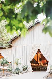 When East Coast Style Meets The West At An Elegant Seaside Bluff Affair In Santa Barbara Rustic Ranch Weddings California Wedding Venues Barn Wedding Venue