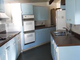 Kitchens then used bold colors like yellow, blue and jadeite green with checkerboard floors and vivid patterns. St Charles Metal Cabinets Full Kitchen Blue White In Color Vintage Sweet Used Kitchen Cabinets Metal Kitchen Cabinets Retro Kitchen