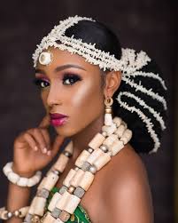 Lace & tulle fabric illusion sweetheart neckline 3/4 sleeves; White Coral Beads A Popping Lippie Will Be A Unique Igbo Bridal Look Bellanaija Weddings