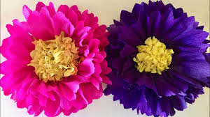 For the flower centers, cut circles out of tissue paper, scrunch the edges, and glue two layers these flowers are fabulous in a big way! Big Paper Flowers Craft Giant Paper Flowers For Decoration Wall Decoration Paper Flowers Youtube