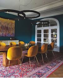 We Love The Mustard Yellow On These Iconic Gubiofficial Chairs Plus The Teal Wall And The Rug Perf Dining Room Teal Yellow Dining Room Yellow Dining Chairs