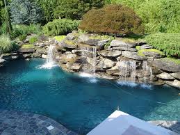 How S This For A Backyard Pool It Looks Like A Real Pond Backyard Pool Landscaping Pool Waterfall Swimming Pools Backyard