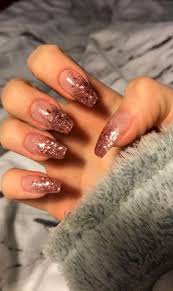 Glittery Ombre Rose Gold Nails Rose Gold Nails Design Gold Nail Designs Pink Glitter Nails Coffin shaped nails (also known as ballerina nails) feature long length and squared tips.