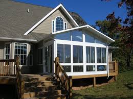How Much Does It Cost To Build A Sunroom Addition We Built This Sunroom Over An Existing Deck Then We Added Some Additional Decking To Provide An Area To Enj Sunroom Decorating House With Porch Sunroom Designs