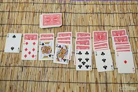 Alternatively, in order to play with large layouts on a card table, miniature playing cards are available. How To Set Up Solitaire Solitaire Card Game Solitaire Cards Card Games For One