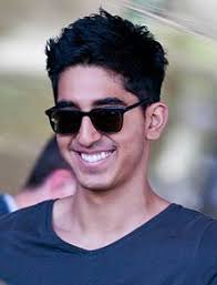 With my headphones and my nike shoes. Dev Patel Wikipedia