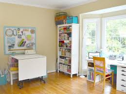 Large long double work tables for wiring projects and area for supplies with direct over head lights. Pictures Of Craft Rooms Favecrafts Com