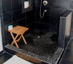 The pebble shower floor has long been popular with homeowners who like to get creative with interior design ideas. Black Pebble Shower Floor Flooring Ideas Floor Design Trends Pebble Shower Floor Shower Floor Floor Design
