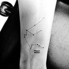 Top 67 Aquarius Tattoo Ideas 2021 Inspiration Guide Aquarius Tattoo Tattoos For Guys Wrist Tattoos For Guys