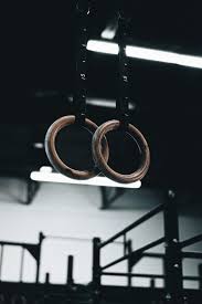 Woman performing gymnastic routine on top of grey concrete railings with both of hands image behind wallpaper. Gymnastic Rings Rings Gym Sport Hd Mobile Wallpaper Peakpx