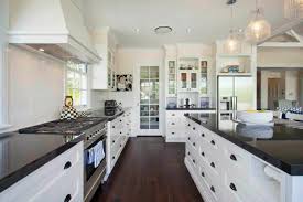 There's something about the contrast between dark wood. 10 Beautiful Kitchens With Dark Hardwood Floors