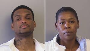 Police find murder suspect already behind bars; girlfriend arrested as an  accessory