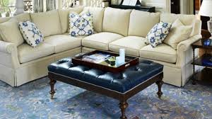 Other common uses of an ottoman are as a footrest or makeshift coffee table if you place a sturdy tray on the top to hold all items steady and to prevent spills. How To Choose An Ottoman As A Coffee Table Homeluf Com
