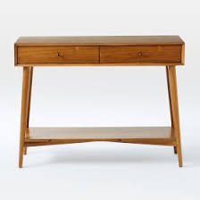 A lower shelf rounds out this piece's organization options with the perfect spot for larger clutter or spacious decorative objects. Mid Century Console Acorn