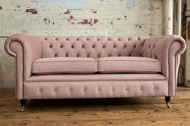 Both the armrests and the sofa's back typically curve outwards towards the top of the sofa, giving it an unmistakable look. Ashley Chesterfield Sofa Chesterfield Sofas Oswald Pablo