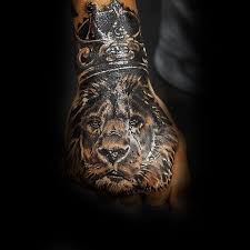 50 Lion With Crown Tattoo Designs For Men Royal Ink Ideas Tattoos For Guys Lion Hand Tattoo Crown Hand Tattoo
