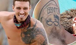 Golden heart and pink ribbon tattoo photo: Survivor Australia Star Luke Toki Shows Off Quirky Santa Tattoo On His Armpit Daily Mail Online