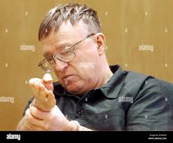 James Oswald motions with his hands Monday, May 9, 2005, at the Waukesha  County Courthouse in Waukesha, Wis., as if he where holding a gun while  talking about an April 1994 fatal