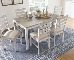 Looking for attractive and enduring dining table of your choice at best prices in houston? The Skempton White Light Brown Dining Room Table Set 7 Cn Available At 5 Star Furniture Serving Houston Tx And Surrounding Areas