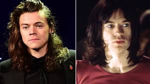 His shirt is tastefully unbuttoned. Smiling Harry Styles Hints He May Play Sir Mick Jagger In Film Itv News