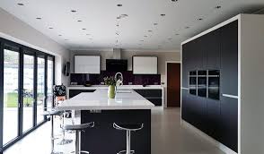 The tall white cabinets give the room a gracious look. Modern Large Kitchen Islands Novocom Top