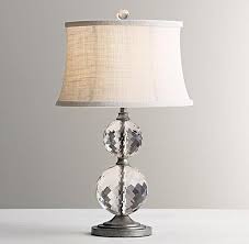 The combination of brass, metal and glass adds an industrial edge to your home. Lourdes Stacked Clear Crystal Ball Ivory Table Lamp Base