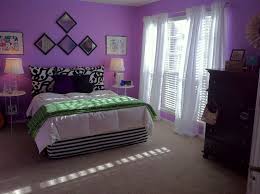 The room offers a cozy bed lighted by two table lamps. Top Interesting Room Design Purple Walls Bedroom Multitude 5272 Wtsenates