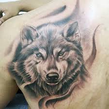 40 Wolf Back Tattoo Designs For Men Fierce Ink Ideas Wolf Tattoos Men Tattoo Designs Men Wolf Tattoo