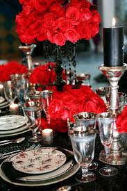 This tablescape brings a bit of shine to traditional fall decor with glimmering gold vases, gilded flatware and a beaded tablecloth. Pin By Carrie Mcclanahan On Wedding Decorations Wedding Table Settings Black Wedding Table Setting Wedding Decor Elegant