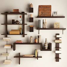 Organize loose papers and periodicals here, and display hardcover books on nearby shelves. Shelving Wall Decor Floating Shelves Living Room Wall Shelves Design Diy Wall Shelves