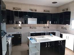 مطبخ باللون الاسود والابيض تم تنفيذه الأندلس لأعمال النجارة والديكور Facebook