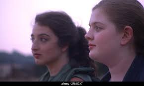 WHAT LIES WEST, from left: Nicolette Kaye Ellis, Chloe Moore, 2019. ©  Passion River Films /Courtesy Everett Collection Stock Photo