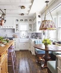 An airy palette of white and blue instills a steady sea of calm, while curving corner brackets on island cabinetry makes the classic space more approachable. Step Inside Designer Philip Mitchell S 18th Century Seaside Cottage Cottage Kitchens Home Kitchens Kitchen Design