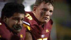 Rocky Mountain football's Ethan Thomason watches offers pour in