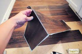 How To Easily Install Peel And Stick Vinyl Diy Kitchen Flooring Diy Flooring Peel And Stick Vinyl