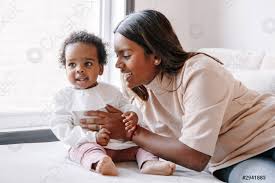 Happy Smiling Young Indian Mother Playing With Black Baby Girl Stock Photo Crushpixel