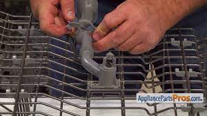 Push the lever down on the left rail and up on the lever on the right rail and finish pulling the rack out ask your own appliance question How To Ge Upper Dishrack Assembly Wd28x10410 Youtube